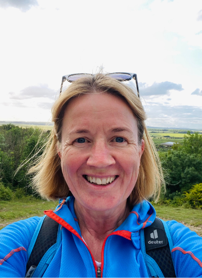 Selfie of Rachael Fake taken on a very sunny evening in the Wiltshire countryside