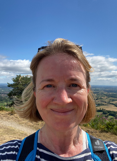Selfie of Rachael Fake taken on a very sunny day at the top of Jubilee Hill in the Malverns